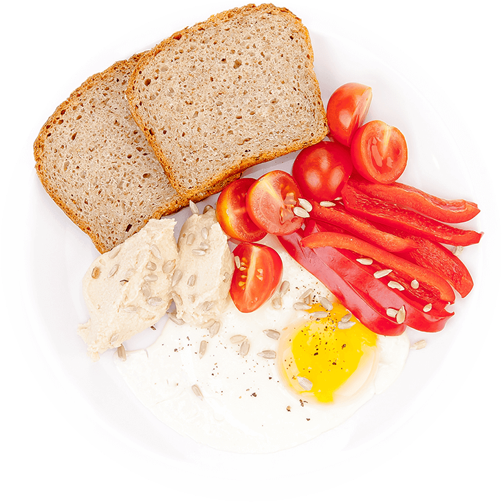 Fried eggs with hummus and vegetables