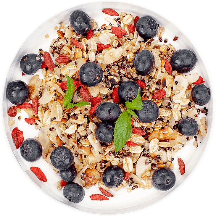 Granola with quinoa, oats, nuts and yoghurt with blueberries and goji berries