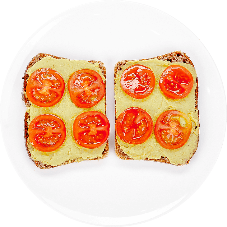 Sandwich with avocado and garden peas paste with tomato