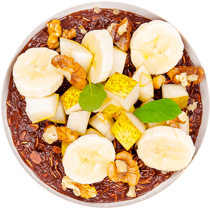 Porridge with milk, banana, pear, cocoa powder and walnuts