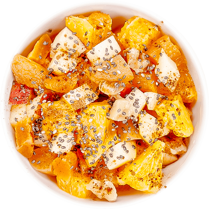Fruit salad with orange, apple, dried apricots and chia seeds