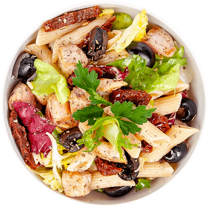 Salad with chicken, pasta, dried tomatoes and olives
