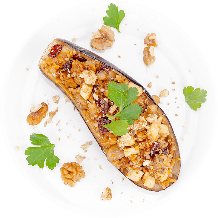 Stuffed aubergine with tofu, buckwheat, mushrooms and cranberries