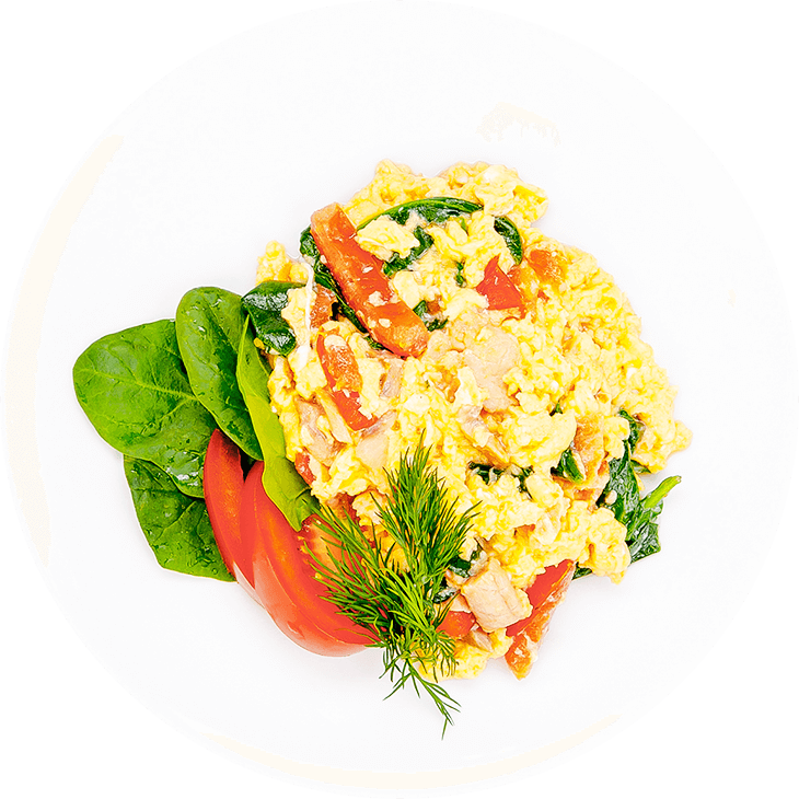 Scrambled eggs with salmon, spinach and tomato