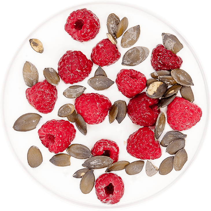 Soya yoghurt with raspberries and pumpkin seeds