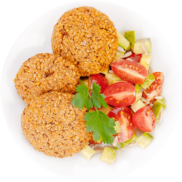 Quinoa and kidney bean burgers with avocado and cherry tomatoes salad