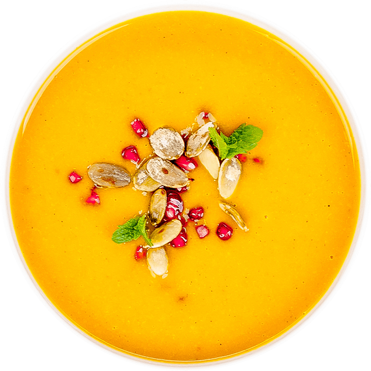 Pumpkin cream soup with pomegranate seeds